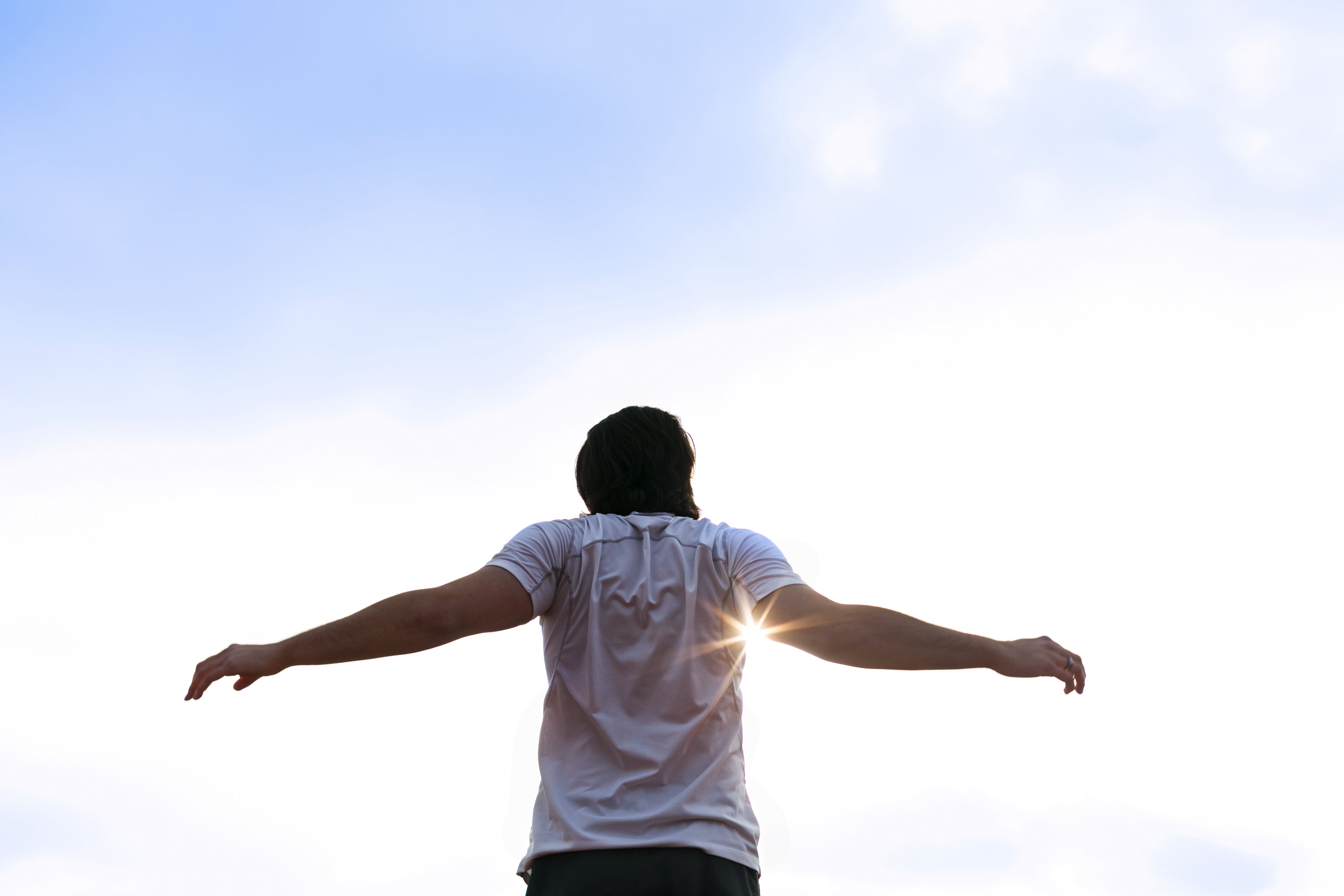 files/runner-stretching-arms-in-sun.jpg